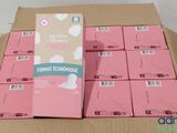 lot of pink boxes of toilet tissues sitting on top of a cardboard box