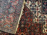 several oriental rugs are laid out on the floor in a room