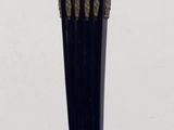 a blue vase sitting on top of a wooden table