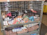 a metal cart with food inside of it in a warehouse