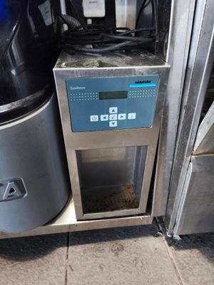 an image of a coffee maker that is on the ground