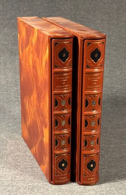 an image of two books sitting on top of each other on a table