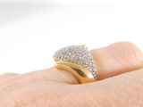 a person ' s hand with a diamond ring on it