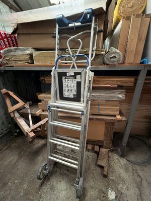 a ladder that is sitting in the middle of a room