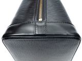 a close up of a black purse on a white background