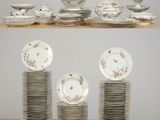 a lot of plates and bowls on a table