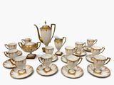 a lot of coffee cups and saucers on the table
