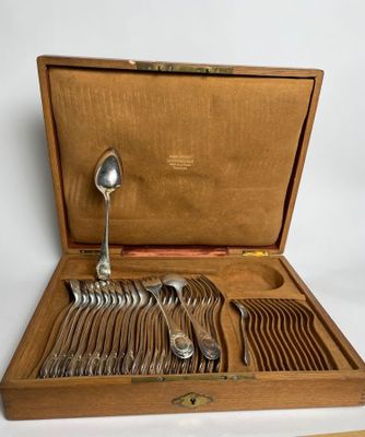 a wooden box with a set of silverware in it