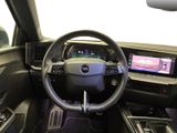 the interior of a car with a steering wheel and dashboard controls