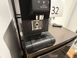 a coffee machine that is sitting on top of a counter