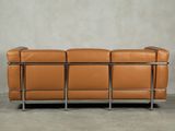 an image of a brown leather couch with a metal frame