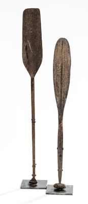 two paddles that are sitting on top of each other