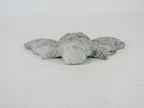 a statue of a turtle that is laying on the ground