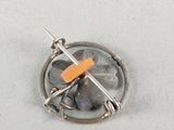 a picture of a pin with a piece of orange tape on it