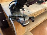 someone is using a circular saw to cut a piece of wood