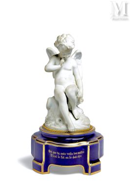a statue of an angel sitting on top of a table