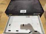 a black box with a number on it sitting in a warehouse