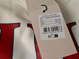 the back of a white t - shirt with a barcode on it