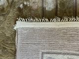 a close up of a piece of fabric on a bed