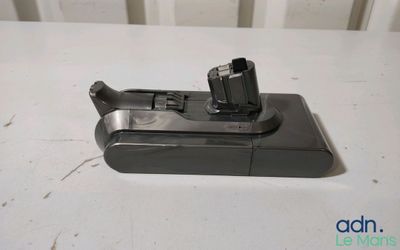 a close up of a cell phone charging dock on a table