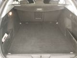 a trunk of a car with the back seats folded down