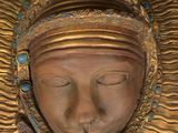 an image of a close up of a statue of a person wearing a headdress