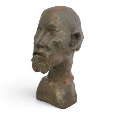 an image of a bronze bust of a man with a beard