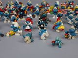 a lot of small figurines that are on a table