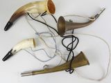 a lot of horns that are laying on a table