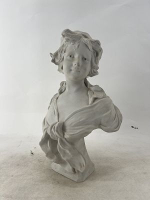 statue of a young girl holding a flower in her right hand