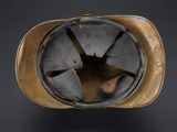 an old helmet with a hole in the middle of it
