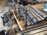 many different types of steel pipes in a warehouse