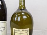 two bottles of wine sitting next to each other on a table