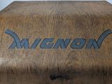 a wooden box with a metal handle on a table