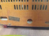 a cat that is sitting inside of a cat carrier