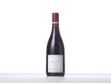 a bottle of red wine sitting on top of a table
