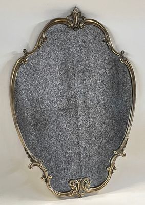 a close up of a mirror sitting on top of a table