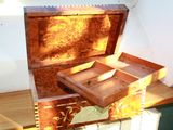 a wooden box that is open on top of a table