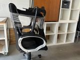 a chair that is sitting in the middle of a room