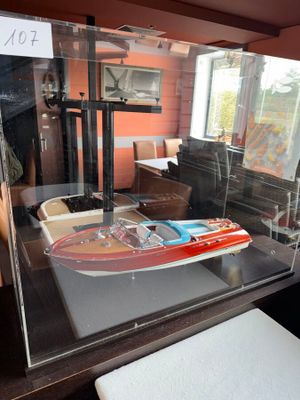 a display case with a model of a boat in it