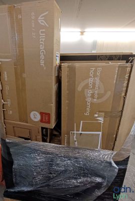a pile of boxes sitting on the floor in a room