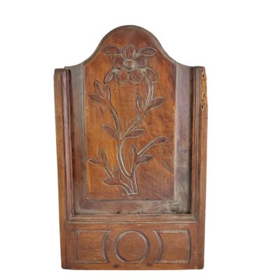an old wooden door with a flower carved into it