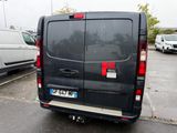 a black van that is parked in a parking lot