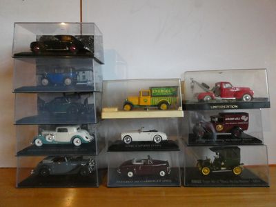 a lot of toy cars that are in a display case