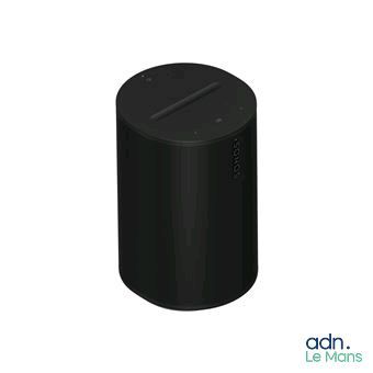 an image of a black speaker sitting on top of a white surface