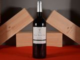 a bottle of wine that is sitting on a table