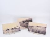 three cards with a picture of a boat in the water on them