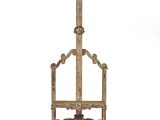 an old wooden easer with a wooden top and a metal stand