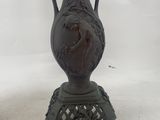 pair of antique cast iron vases on cast iron stand