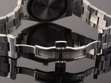a close up of a wrist watch on a reflective surface